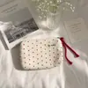Simple monedero de tela estilo coreano con pequeñas estrellas impresas por todas partes, disponible en varios colores, adecuado para guardar joyas, audífonos y monedas