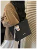 Bolso tote de mimbre tejido a mano retro de nicho para mujer, nuevo y moderno 2026 de gran capacidad para el trabajo y los desplazamientos, bolso de hombro de moda