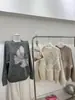 Suéter de punto redondo con jacquard de mariposas estilo coreano, nuevo diseño otoño e invierno 2026, top de punto holgado para mujer