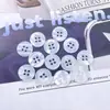 Resina de liquidação botão corrugado genuíno perolado quatro furos de aba larga botão perolado botão de camisa para roupa de trabalho