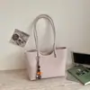 Bolso de mujer de color liso retro de nicho 2026 nueva versión coreana bolso tote simple casual de gran capacidad para el hombro de uso diario
