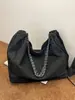 Bolso de mezclilla de gran capacidad para mujer, ligero, nuevo modelo verano 2024, bolso de hombro para estudiante universitario, bolso tote con cadena