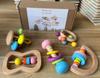 Bebés de madera y niños pequeños pueden morder la campana de mano para captar el entrenamiento auditivo de educación temprana, juego de cinco piezas de juguetes de regalo de nacimiento al por mayor