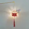 Linterna luminosa de personaje feliz estilo antiguo tejida a mano de bambú linterna de flores de mano linterna pequeña paquete de material DIY colgante venta al por mayor