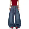 Pantalones versátiles de pierna curva con cordón para mujer, jeans retro azules de corte holgado con un diseño elegante, efecto adelgazante, patchwork de cuadros y bolsillos anchos