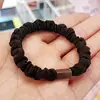 Venta al por mayor de accesorios para la cabeza banda para el pelo de intestino delgado estilo coreano accesorios para el pelo banda de goma versión delgada hebilla plana diy alta elasticidad café negro