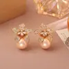 Pendientes de flor de perla y circón transfronterizos europeos y americanos, lujo ligero, pendientes de pétalo de moda de alta gama, pendientes únicos y personalizados para mujer