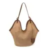 Bolsa tejida de verano nuevo modelo 2026, bolsa de playa de paja de moda para vacaciones, bolso de hombro de nicho para mujer, bolso tote de gran capacidad
