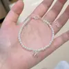 Pulseira de Pérolas Shijia para Meninas Empilhável Camada Dupla Redonda Luxo Leve Nicho Exquisito Pulseira de Pérolas Francesas com Laço