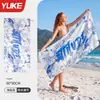 La nueva toalla de playa de Yuke para hombres y mujeres es delgada, suave y de secado rápido, adecuada para nadar y usar en la playa, y es portátil para viajar
