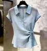 Nuevo top de camisa de manga corta elegante estilo francés para verano, fino, para mujer, con cinturón para ceñir la cintura, diseño calado, moderno y versátil