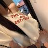 Moletom Cinza com Estampa de Letras Estilo Americano para Mulheres Design de Início de Outono Casual Solto Oversize Top de Ombro