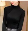 Otoño e invierno 2025 camiseta interior cálida con cuello medio alto forrada de forro polar nueva camiseta de manga larga abrigo ajustado para mujer moda