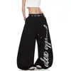 Pantalones de trabajo verano 2026 nuevo estilo calados retazos sueltos casuales de pierna ancha para personas petite pantalones rectos de cintura alta de moda