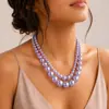 Collar de perlas sintéticas de doble capa para mujer, cadena de clavícula de lujo de alta gama, accesorio versátil y elegante para vestidos de noche