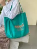 Nuevo bolso de hombro grande para mujer estilo coreano 2026, bolso de mano casual para estudiante con estampado de letras, bolso tote dopamina