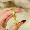 Pulsera de trébol de cuatro hojas lujosa y sofisticada para mujer, diseño de doble capa, chapado en oro de 18 quilates, nácar artificial, joyería de trébol de la suerte, bestseller transfronterizo