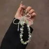 Nueva Cadena para Teléfono Móvil Cadena Colgante de Cristal Diseño de Gama Alta Pequeño Nicho Sentido del Diseño Exquisito Correa Colgante de Muñeca para Mujer Accesorios para Bolsos