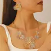 Collar con Colgante de Flor Hueca Pétalo de Tres Dimensiones Cadena Larga Pendientes Collar Anillo Set de Joyería Transfronterizo Europeo y Americano