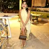 Roupas femininas de cor sólida para comércio exterior, estilo europeu e americano, vestido simples sem mangas, saia irregular de luxo leve, vestido solto da moda de rua com gola alta