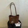 Bolsa casual estilosa de grande capacidade 2026 novo modelo bolsa de ombro casual bolsa de axila padrão trançado bolsa sacola para o dia a dia