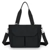 Bolso de mujer tendencia transfronteriza, bolso de hombro para mamá, nuevo modelo 2026, tela de nailon ligera, bolso de tela de color liso, bolso de mano cruzado