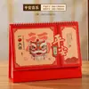 Calendário de Mesa Estilo Nacional Vazado 2027 Personalizado com Hot Stamping Papel Perolado Calendário Alta Aparência Artesanato com Pingente Calendário de Mesa para Desktop