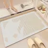 Tapete de piso de tierra de diatomeas con línea ondulada color crema para baño, absorbente de agua, secado rápido, antideslizante, resistente a la suciedad, felpudo para la entrada del baño