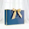 Embalagem de Compras Laço de Presente Sacola de Papel Espessa com Estampagem a Quente em Estoque Comércio Exterior Transfronteiriço Fabricante de Impressão Frete Grátis