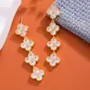Brincos de grama da sorte de temperamento de luxo leve de alta qualidade, agulha de prata s925, borla longa, zircônia, flor de moda para o dia a dia