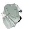 Estoque Disponível Conjunto Esportivo Casual Verão e Outono 2024 para Mulheres, Estilo Coreano Conjunto de Duas Peças Shorts de Manga Curta para o Dia a Dia, Atacado Transfronteiriço