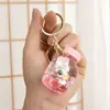 Chaveiro Criativo com Óleo e Design de Morango e Coelho Fofo, Chaveiro de Garrafa com Areia Líquida, Pingente de Bolsa Garrafa de Deriva, Acessório de Acrílico
