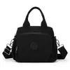 Bolsa feminina de grande capacidade, bolsa de ombro e transversal de nylon casual e moderna, bolsa feminina de lona à prova d'água multicamadas leve