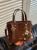 Bolso cruzado pequeño minimalista de moda transfronterizo para mujer, estilo retro 2026 nuevo, bolso cruzado diario para ir al trabajo, bolso tipo cubo tote casual