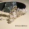 Elegante senso de alta classe de flores borboleta vazada franja clipe de tubarão 2024 novo clipe da nuca mulheres de cabelo requintado