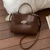 Bolso de mano de alta gama para mujer 2026 nuevo de primavera-verano moderno súper popular para el trabajo y los desplazamientos bandolera cruzada tipo cubo