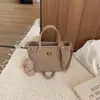 Bolsos de mano para mujer transfronterizos 2026 nuevo modelo principios de otoño bolso de mano simple versátil moda nicho bolso de hombro bandolera tipo cubo