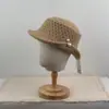 Nuevo sombrero de pescador de punto calado vintage para mujer, elegante y que adelgaza la cara, con decoración de perlas, versátil y elegante