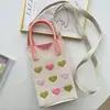 Nuevo diseño de nicho, linda bolsa de teléfono mini de punto de dibujos animados, versátil, compacta, portátil, adecuada para ir al trabajo, bolso cuadrado pequeño cruzado