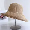 Sombrero de pescador a rayas ligero y transpirable estilo japonés para mujer, decoración con hebilla redonda de verano, sombrero tipo cubo versátil, sombrero de tela con protección solar, moderno