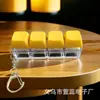 Llavero colgante luminoso con teclas de descompresión de cuatro botones en varios colores para teclado mecánico.