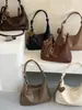 Tendência minimalista transfronteiriça outono 2026 nova moda bolsa de trabalho feminina casual personalizada bolsa de ombro transversal