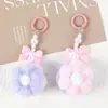 Llavero de Bolas de Pelo con Lazo de Flor de Dos Colores Colgante de Peluche Fresco y Colorido para Teléfono Móvil Colgante de Bolso de Flor Regalo