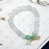 Pulsera de jade Xinjiang Tianshan jade dorado natural jade blanco cuentas redondas pulsera de jade flor flotante suministro en vivo venta al por mayor