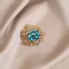 Broche de estilo antiguo nuevo de alta gama ins para mujer estilo chino abanico borla pin de traje cheongsam tapeta de presión corsage al por mayor