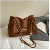 Bolso de axila de nicho de lujo ligero de alta gama para mujer 2026 nuevo de verano super caliente exquisito bolso de hombro individual para ir al trabajo