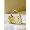 Bolsos exquisitos al por mayor con forma de nube amarilla para mujer, nueva colección de verano 2026, de alta gama, ligeros y elegantes, tipo bandolera