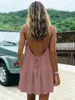 2026 Comercio exterior transfronterizo europeo y americano Amazon vestido corto de color liso con fruncido de seda helada sin espalda con tirantes vestido de vacaciones en la playa para mujer
