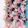 Venta al por mayor Rattan de Flor de Cerezo Simulada Enredadera Envuelta en Tubería de Aire Acondicionado Tiras de Flores Flores Falsas de Plástico Decoración de Bloqueo de Techo de Boda