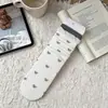 Calcetines de niña estilo coreano con lazo y volantes, colección de principios de otoño, calcetines versátiles de rayas de media pantorrilla, rayas verticales estilo japonés, efecto adelgazante, perfectos con zapatos pequeños de cuero